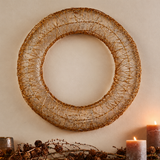 Nkuku Nuha brass wreath framed prominently