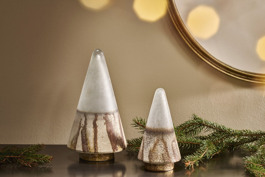 Frosted gold glass Christmas trees beside a vintage mirror